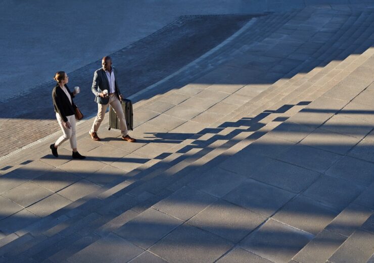 Businesspeople walking on staircase outside